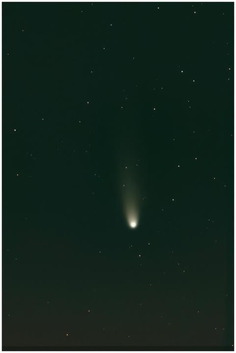 A celestial comet with a glowing tail captured in
