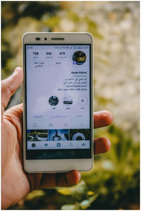 Close-up of a hand holding a smartphone displaying