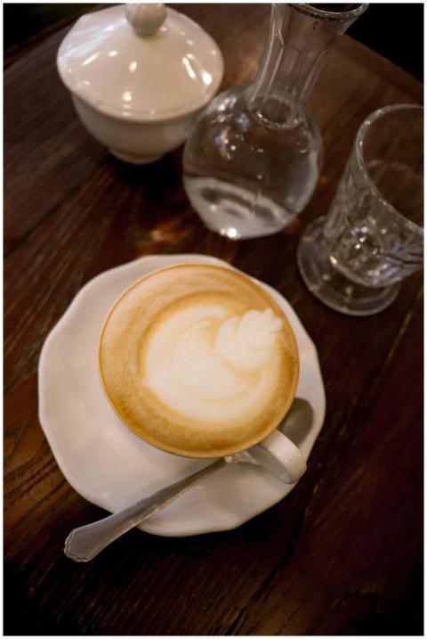 A beautifully crafted cappuccino with latte art on