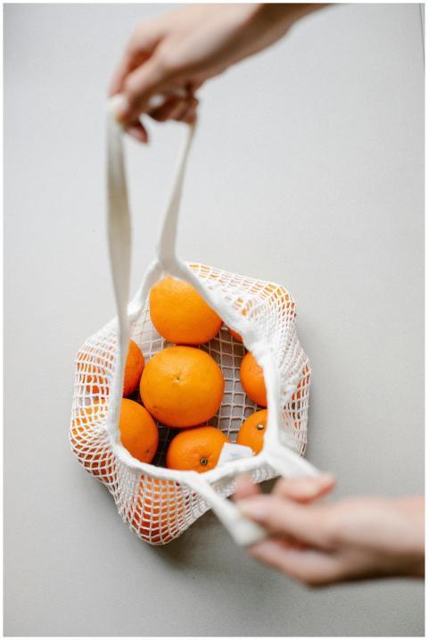 Top view of crop anonymous person with string bag