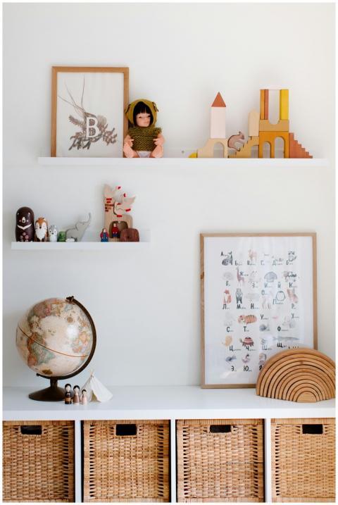 Charming child's room featuring toys, decor, and w