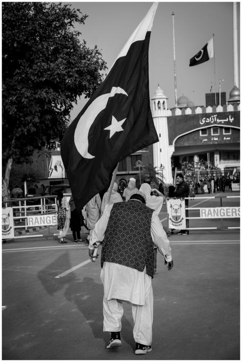 Black and white photo of a person holding a large