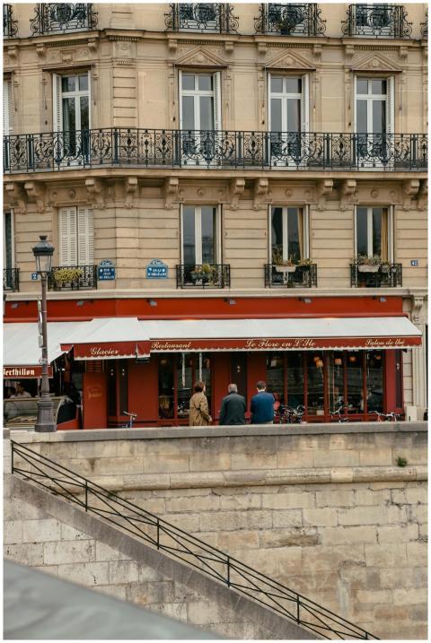 A classic Paris street view featuring a cozy cafe