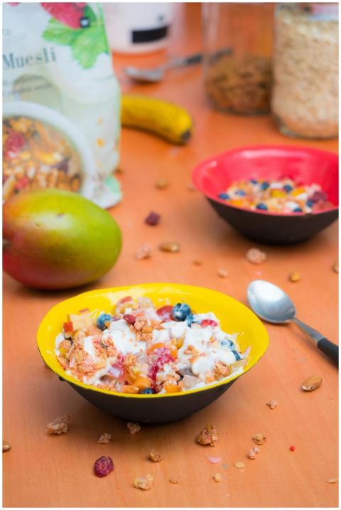 Vibrant breakfast bowl with muesli, yogurt, and fr
