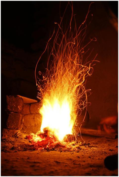 A striking image of a campfire at night with dynam
