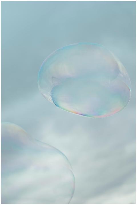 Soft focus image of translucent soap bubbles float