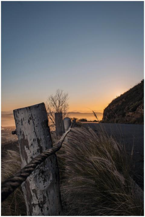 Peaceful sunset over a coastal landscape featuring