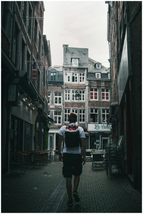 Man walking through the charming streets of Namur,