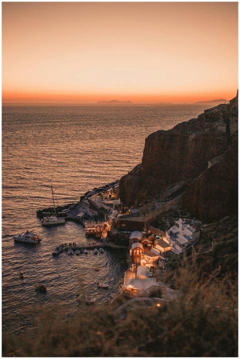 Captivating sunset over a marina with cliffs and s