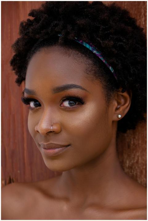 Close-up portrait of a beautiful woman with afro h