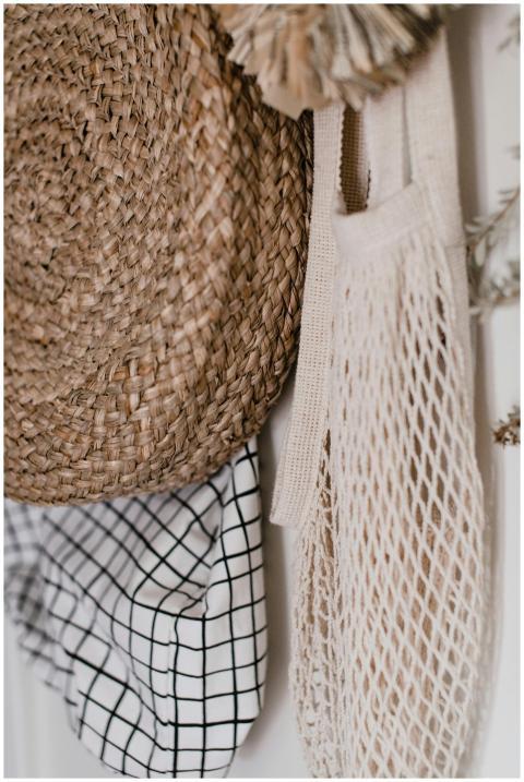 Rustic wall decor featuring a woven hat, checkered