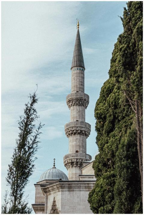 A beautiful mosque minaret in Istanbul contrasted