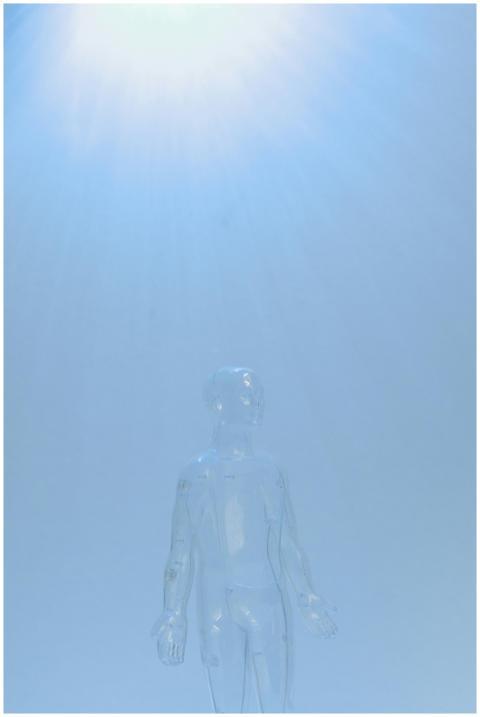 Transparent mannequin illuminated by a cool blue l