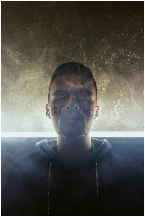 A creative and introspective portrait of a young m