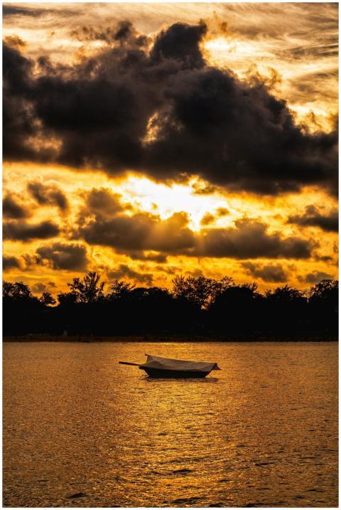 Serene scene of a boat on the water during a stunn