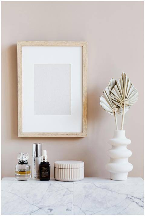 Elegant cosmetic setup with framed art and decor o
