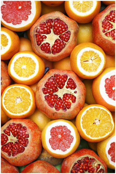 Colorful mix of sliced citrus fruits and pomegrana