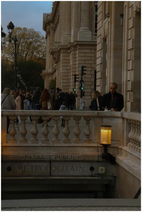Crowded street scene in Paris with classic archite