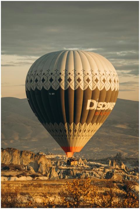 A majestic hot air balloon soars over Cappadocia's
