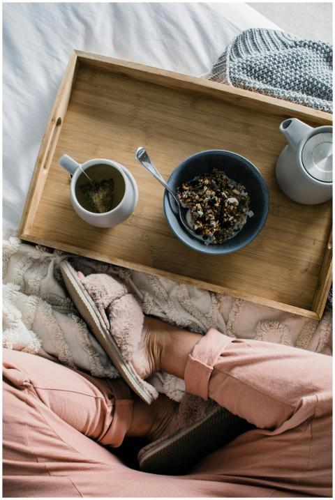 Top-down view of a relaxing breakfast tray with te