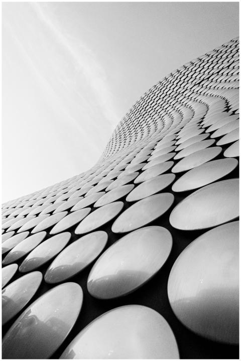 Sleek modern building facade with circular pattern