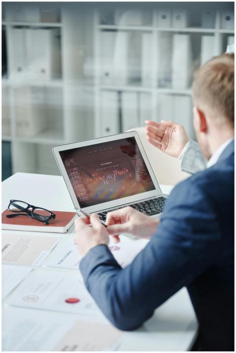 Two professionals discussing a financial analysis