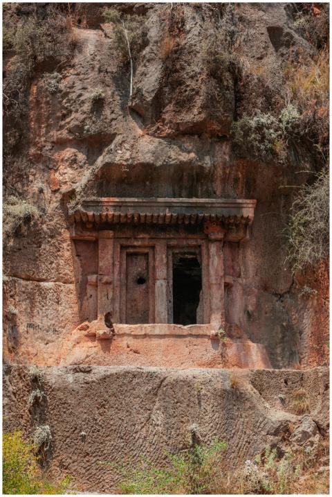 A historic rock-cut temple entrance nestled within