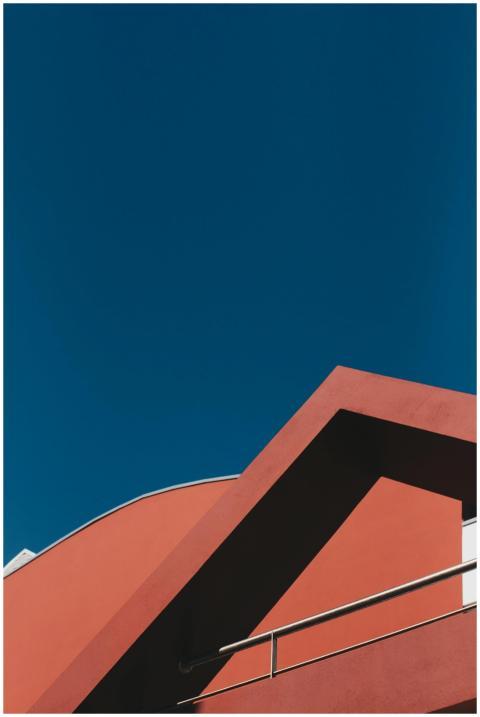 Striking red building facade with geometric design