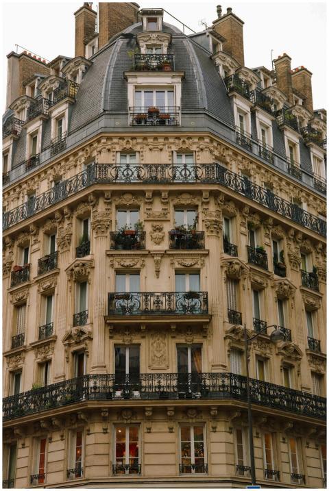 Charming Haussmann-style building facade in Paris,