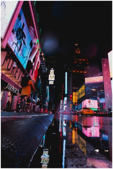 Illuminated street scene of Times Square with neon