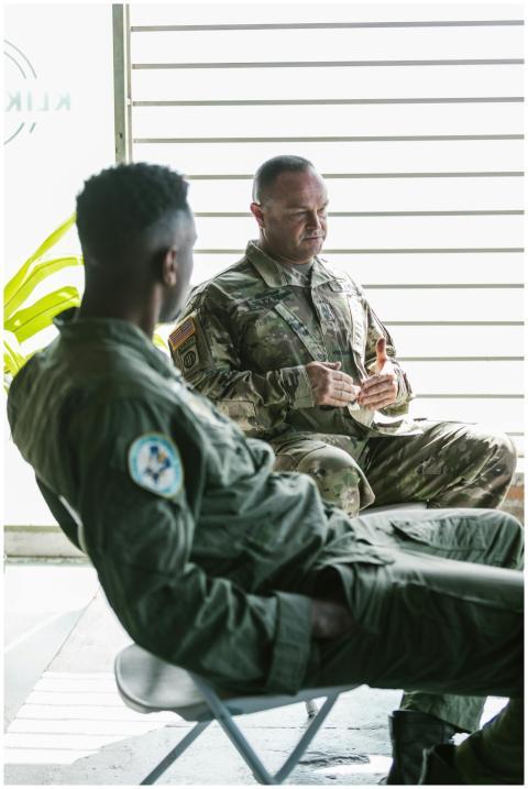 Military personnel engage in a counseling session