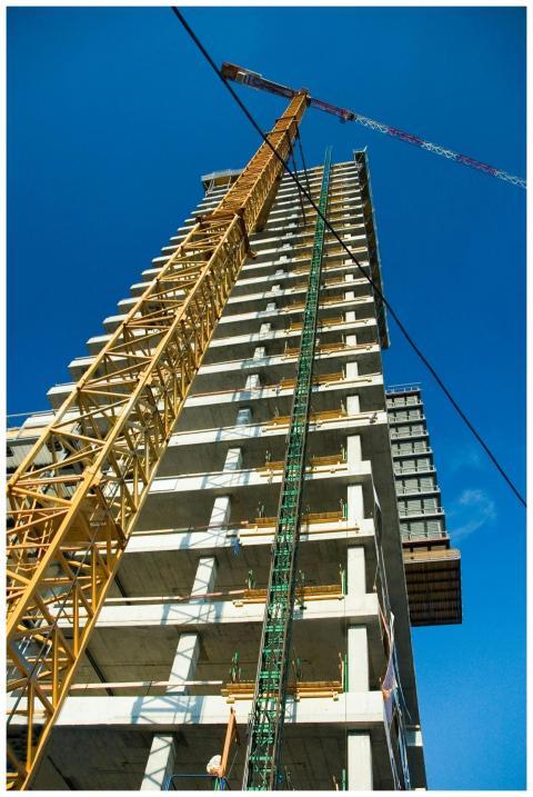 Low-angle view of skyscraper under construction wi