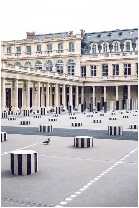 A view of minimalist black and white columns in th