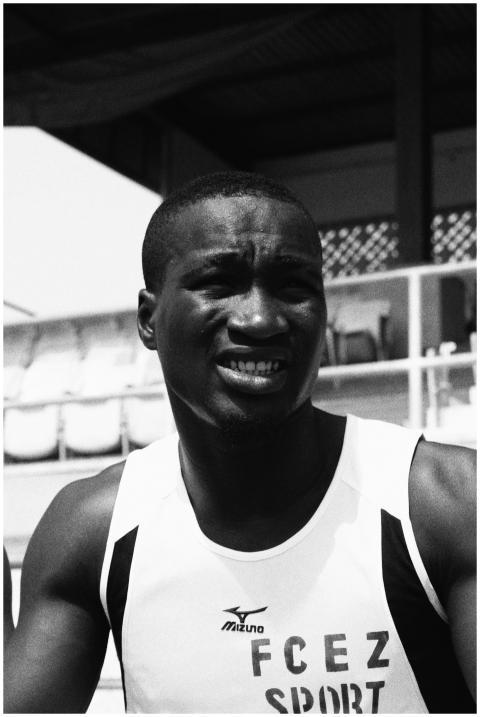 Grayscale close-up portrait of a male athlete in a