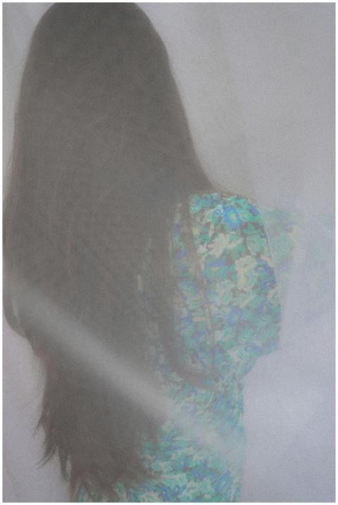 Ethereal portrait of a woman with long hair, veile