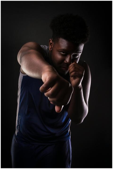 Dynamic portrait of a strong African American boxe