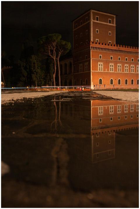 Captivating night view of Roman architecture refle