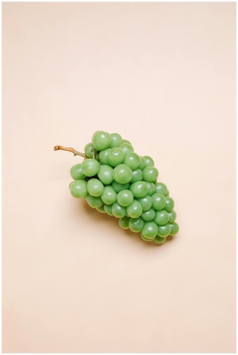 Top view of ripe tasty fresh bunch of green grapes