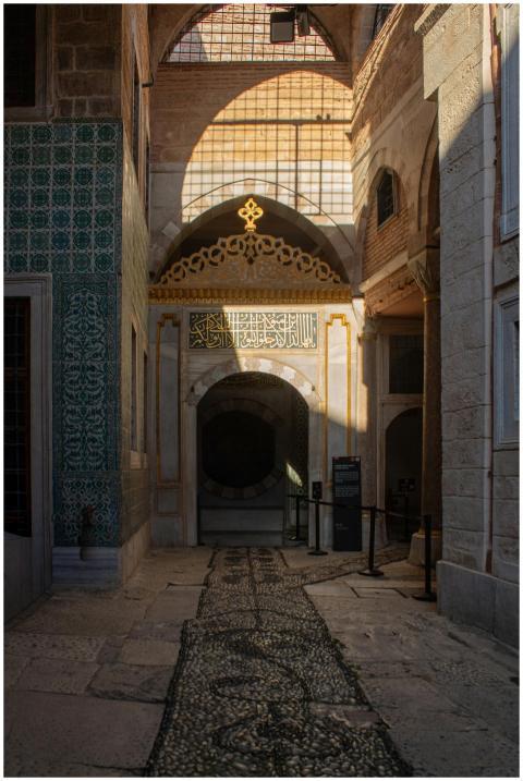 Sunlit corridor highlighting Ottoman architectural