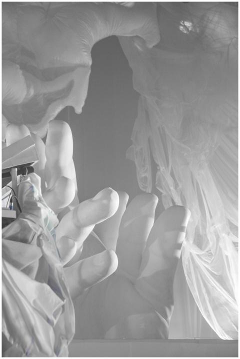 Monochrome sculptural installation featuring large