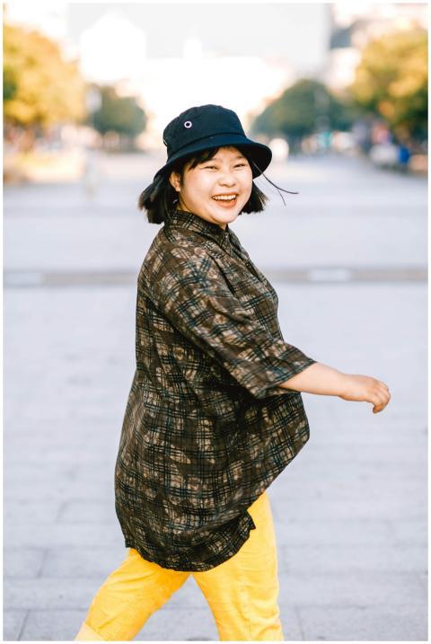 Stylish woman in casual attire, smiling confidentl