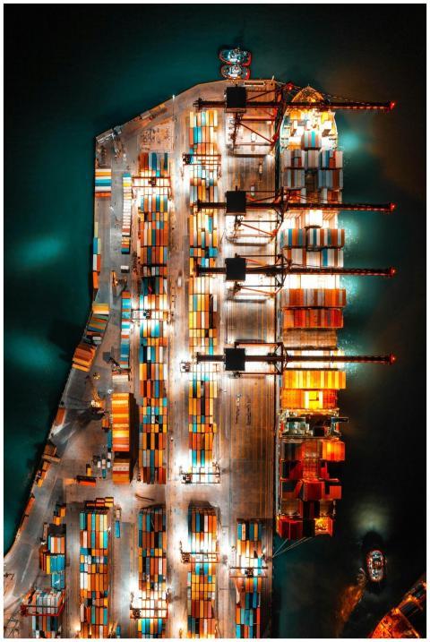 Dramatic aerial view of a busy shipping port with