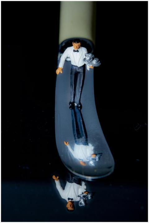 Creative image of a miniature butler figurine on a