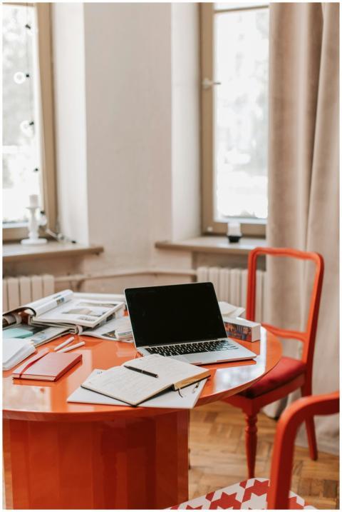 A stylish home office setup featuring a red round