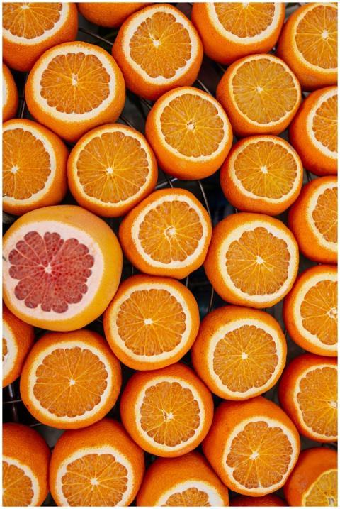 Top view of sliced oranges and grapefruit creating