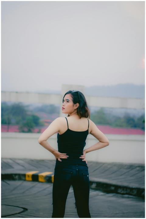 An outdoor portrait of a woman standing confidentl