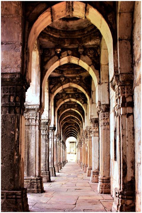 A stunning view of ancient stone arches in a histo