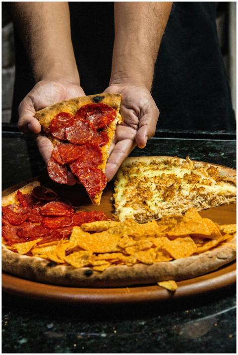 A close-up shot of a pizza with various toppings b