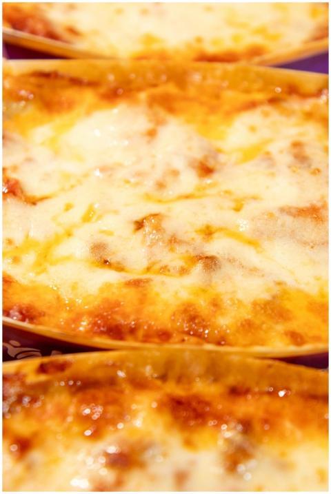 Appetizing close-up of hot and cheesy lasagna with