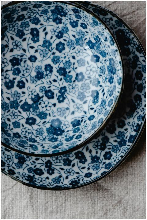 Delicate floral ceramic bowl and plate with intric